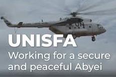 A helicopter flying against a dark grey sky with the words "Working for a secure and peaceful Abyei"
